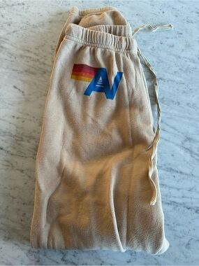 Aviator Nation Beige womens Sweatpants with Rainbow Stripe and Blue 'A' Logo